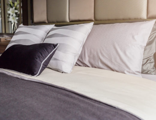 bed gray covers, white pillows