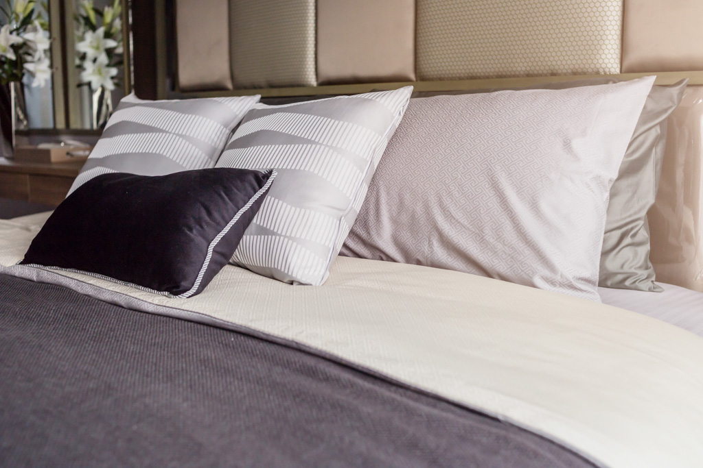 bed gray covers, white pillows