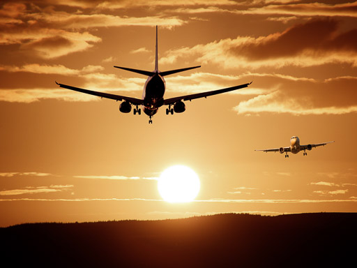 TravelAfter5_Dumb Money-Saving_Flights TravelAfter5_Dumb Money Saving_Two Aircrafts against Sun